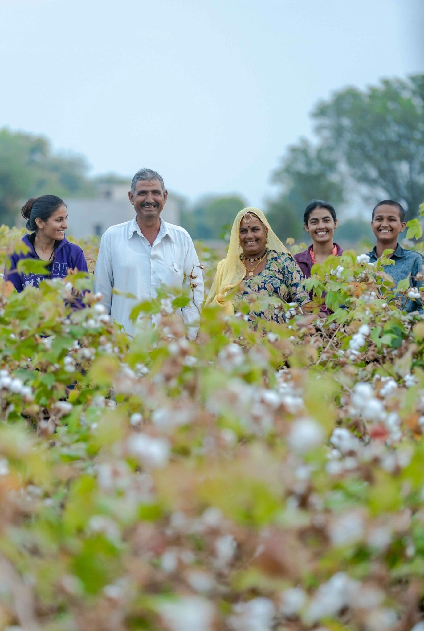 Farmer and family in field